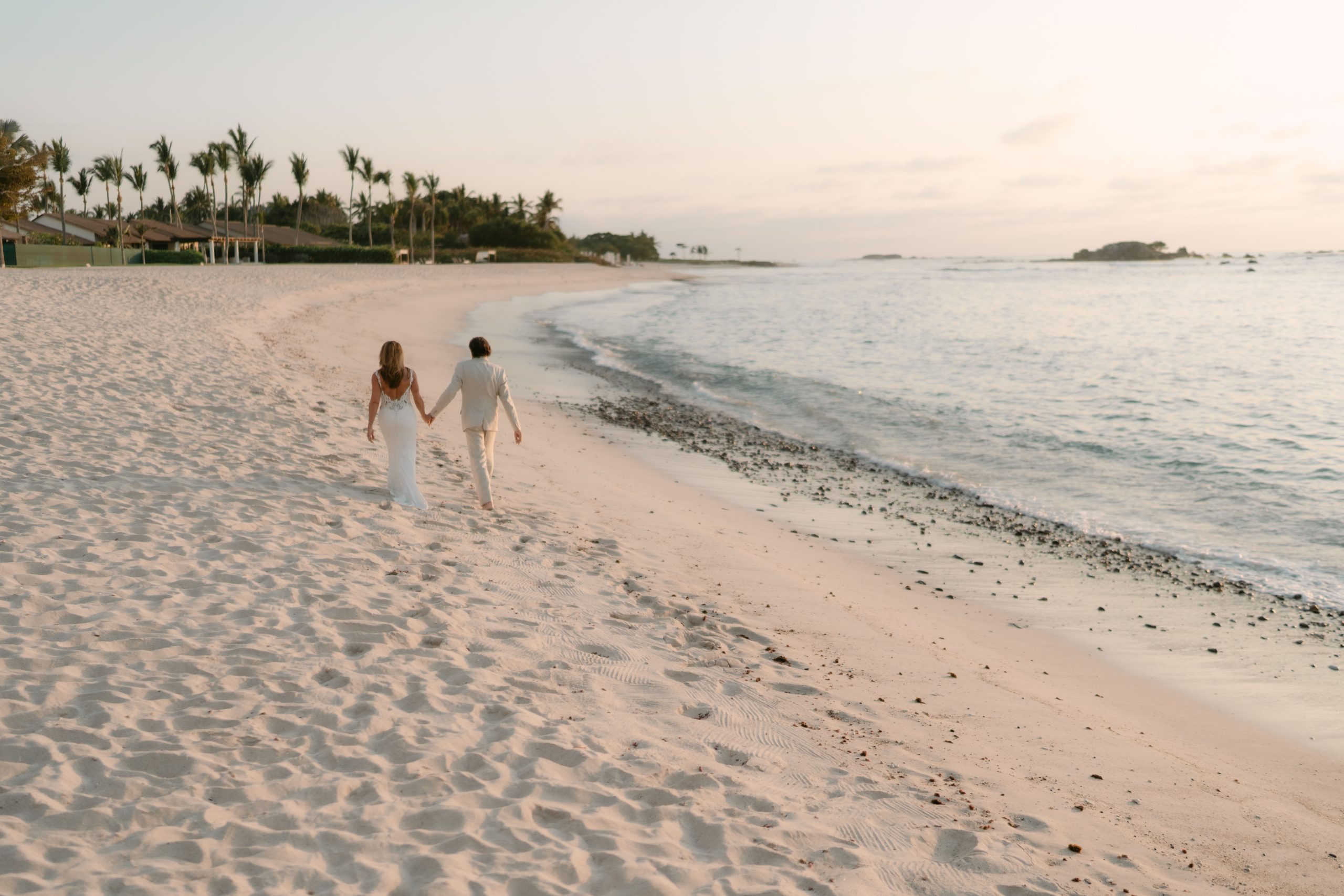 Wedding couple at Four Seasons Punta Mita with ocean views on Mexico's Pacific coast.