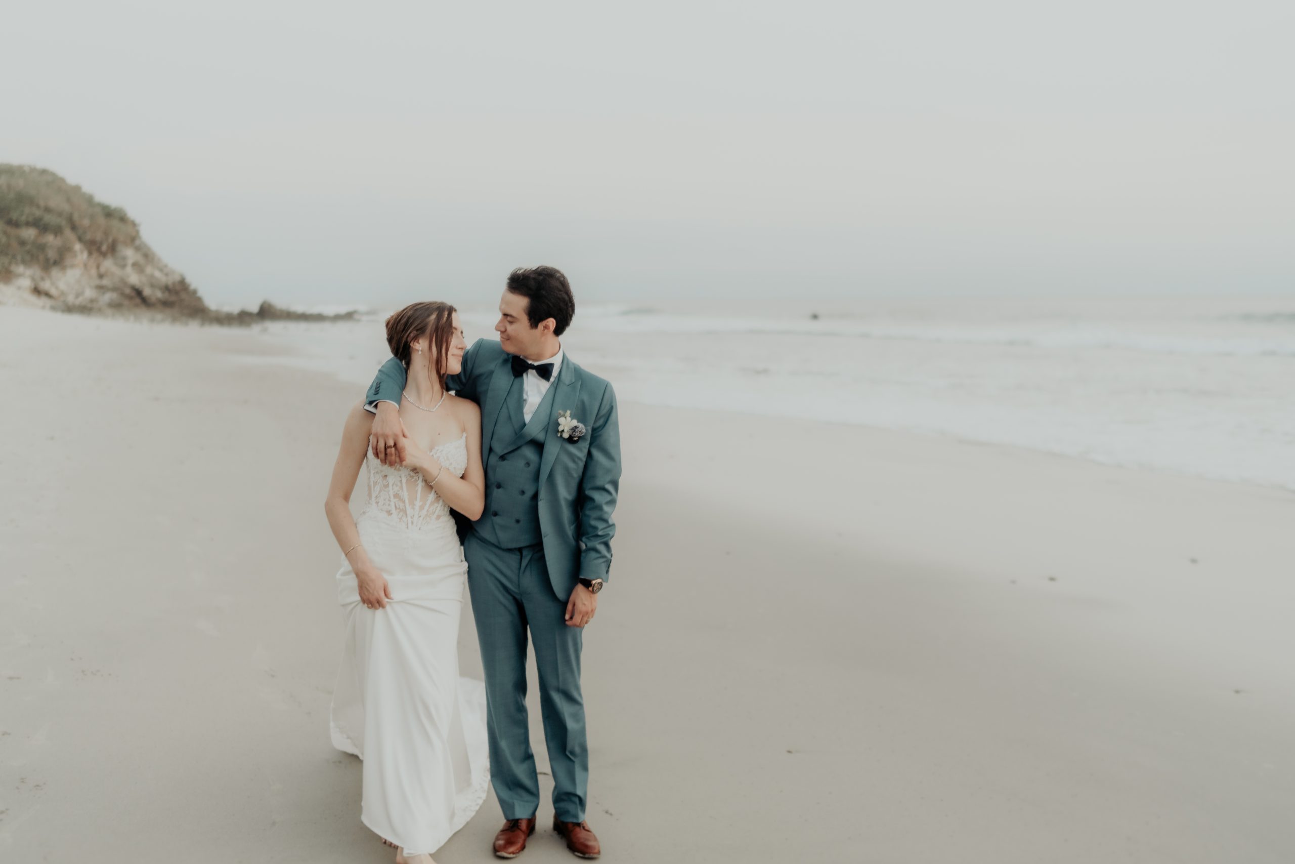 Bride and groom embracing at NIA Venue during a destination wedding in Punta Mita, Mexico